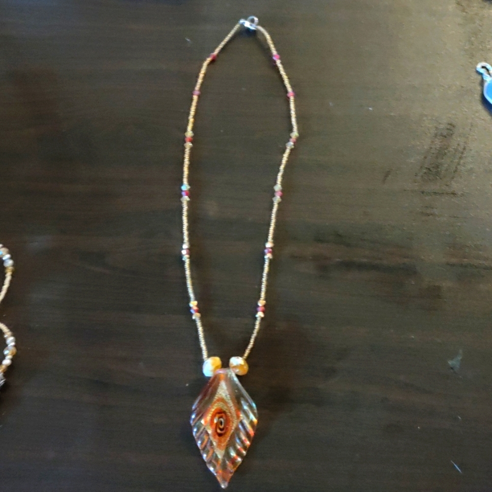 Glass pendant with swarovski crystals and glass seed beads